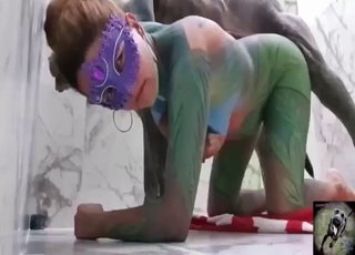 Girl in the oddest bodysuit bangs her dog