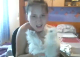 Cute zoophile lets dog suck on her tits and such