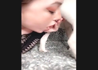 Black-outfit girl kissing dog dick sloppily