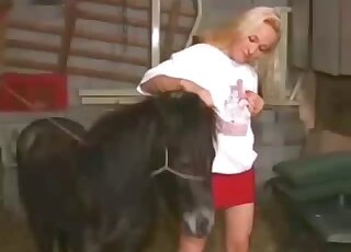 Blonde angel is playing with a beast dick